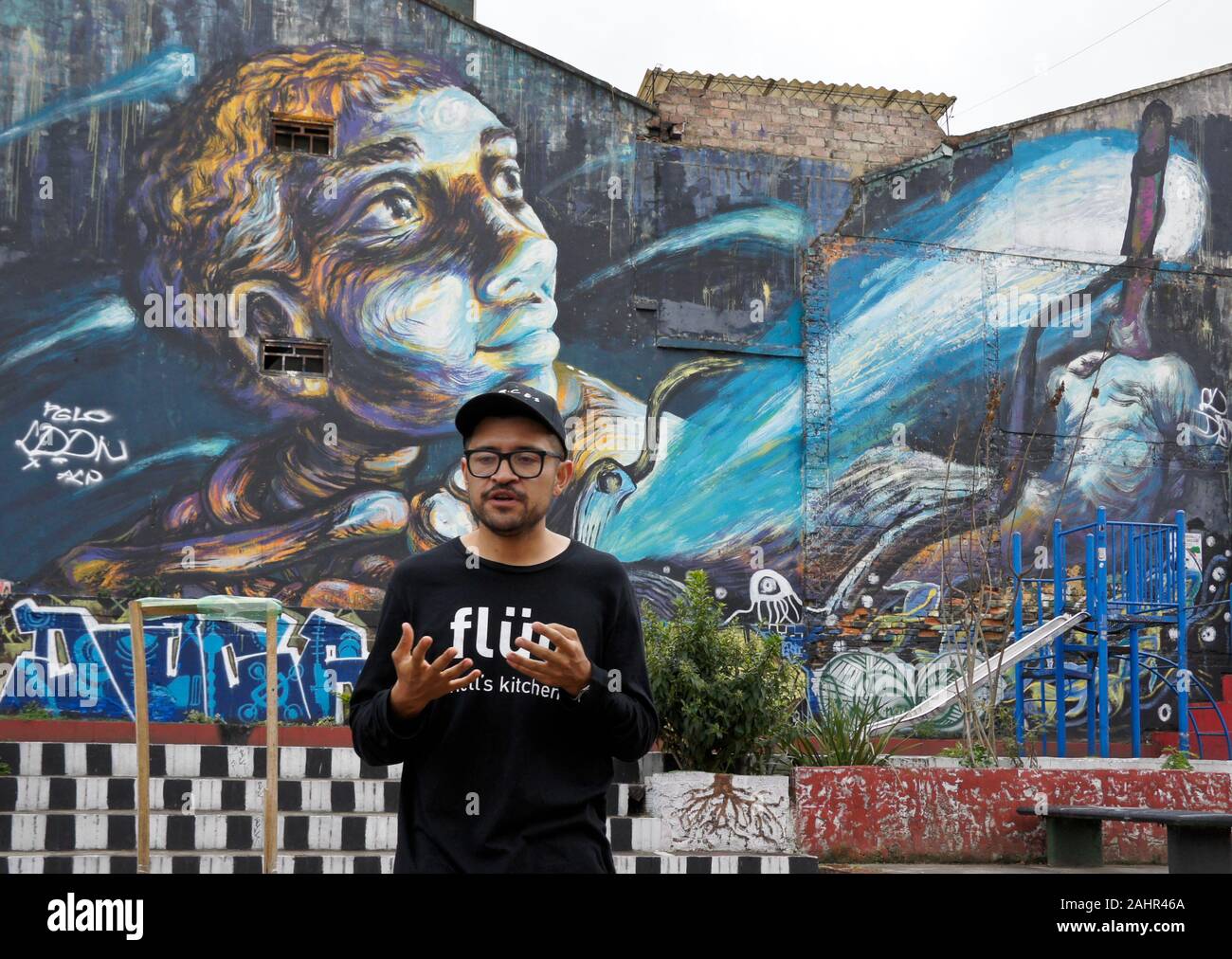 Artist Leading Walking Tour Of Street Art Murals This One By Bastardilla And Graffiti In La Candelaria District Of Bogota Colombia Stock Photo Alamy
