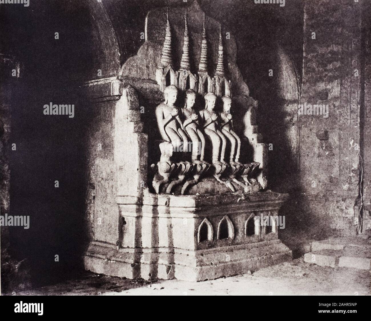 Linnaeus Tripe. No. 23. Pugahm Myo [Pagan]. Figures in Damayangyee Pagoda [Dhamma-yan-gyi].. 1855. England. Salted paper print, from the album Views of Burma (1856) Linnaeus Tripe produced some of the earliest photographs ever made of British India and Burma. The British ruled large parts of India through the East India Company, a corporation with its own private armies and governmental functions. Tripe rose through the ranks of the Company’s army and began to experiment with photography in the early 1850s, photographing temples and other Indian monuments. In 1855, James Broun-Ramsay, the Brit Stock Photo