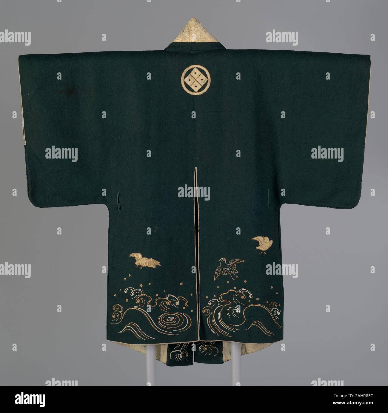 Short Coat. 1801–1850. Japan. Wool, plain weave, fulled (gorofukuren); appliquéd with silk, plain weave with supplementary pile warps forming solid velvet; embroidered with silk, gilt-strip-wrapped-silk; silk and gilt-paper-strip, twill weave with secondary binding warp and patterning weft; lined with silk, plain weave; edged with silk and gilt-paper-strip, twill weave with secondary binding warps and patterning wefts Stock Photo
