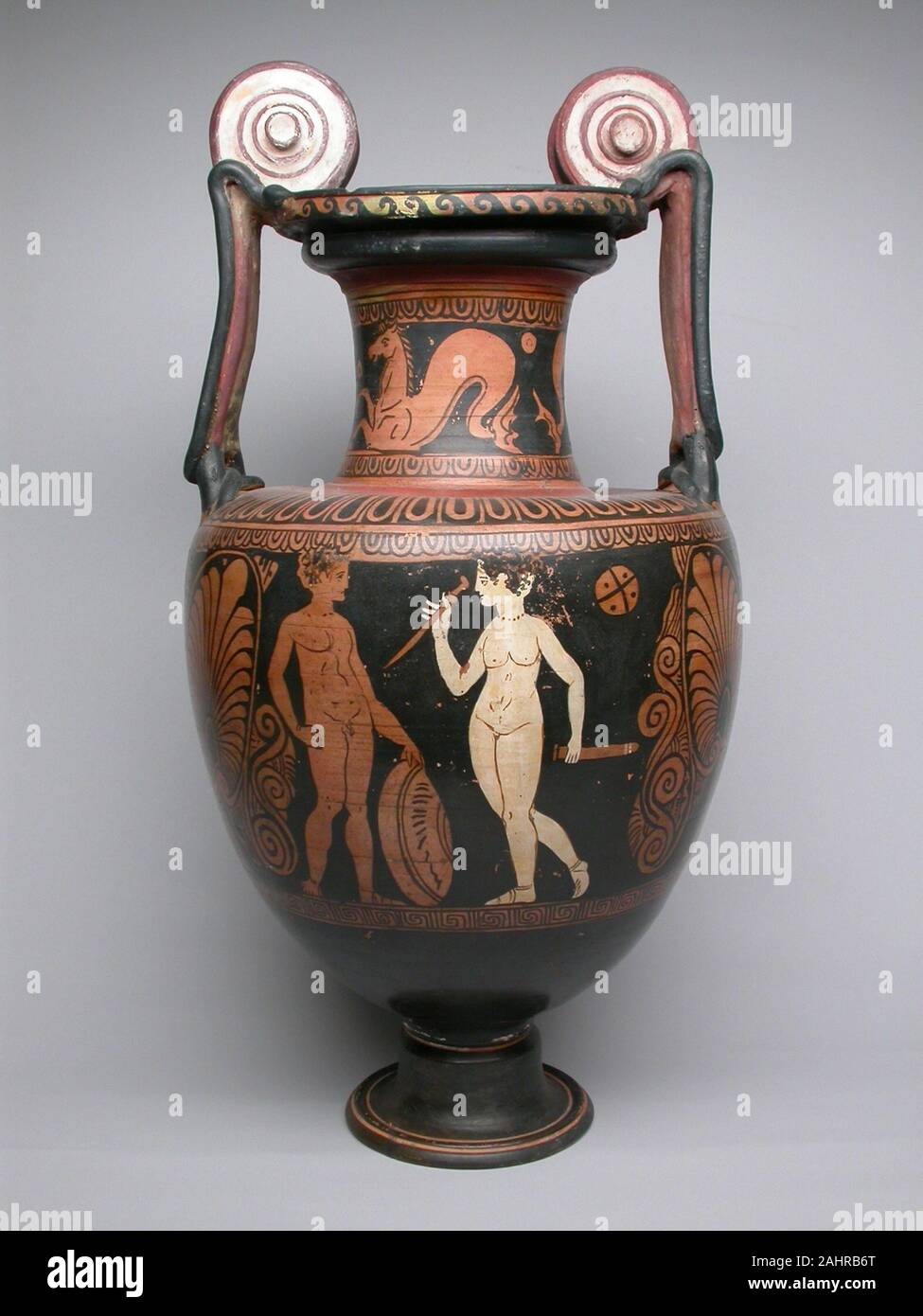Ancient Greek. Amphora (Storage Jar). 400 BC–301 BC. Central Italy. terracotta, decorated in the red-figure technique With its monumental proportions, white volute handles, and red-figure decoration, this amphora bears a striking resemblance to vases from Apulia on the eastern coast of southern Italy. However, this vase belongs to the Faliscan culture, the Etruscans’ southernmost neighbor in the region of modern-day Tuscany. Together, the Etruscans and Faliscans would struggle against Roman expansion. The high quality and popularity of the Faliscan wares vied with Roman ceramic production, int Stock Photo