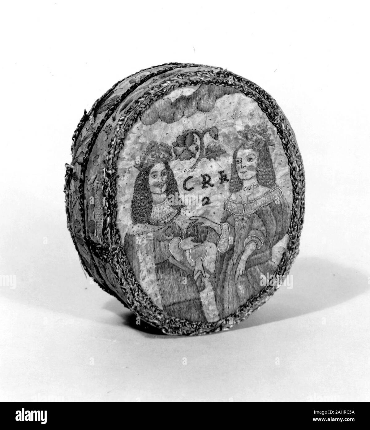 Oval Box Showing Charles II and Catherine of Braganza. 1650–1670. England. Silk, plain weave; embroidered with silk floss foremost in satin stitch; French knots Stock Photo