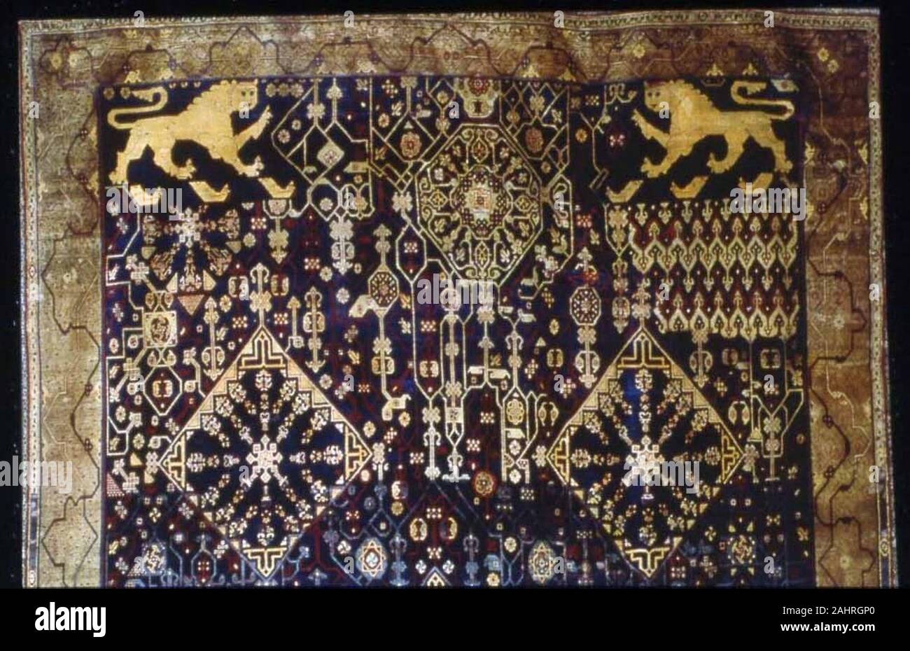 Carpet. 1676–1725. Morocco. Wool and silk, plain weave with supplementary wrapping wefts forming cut pile through a technique known as Persian ( Sehna ) knots; edged with cotton, and wool weft-faced warp-ribbed plain weave Stock Photo