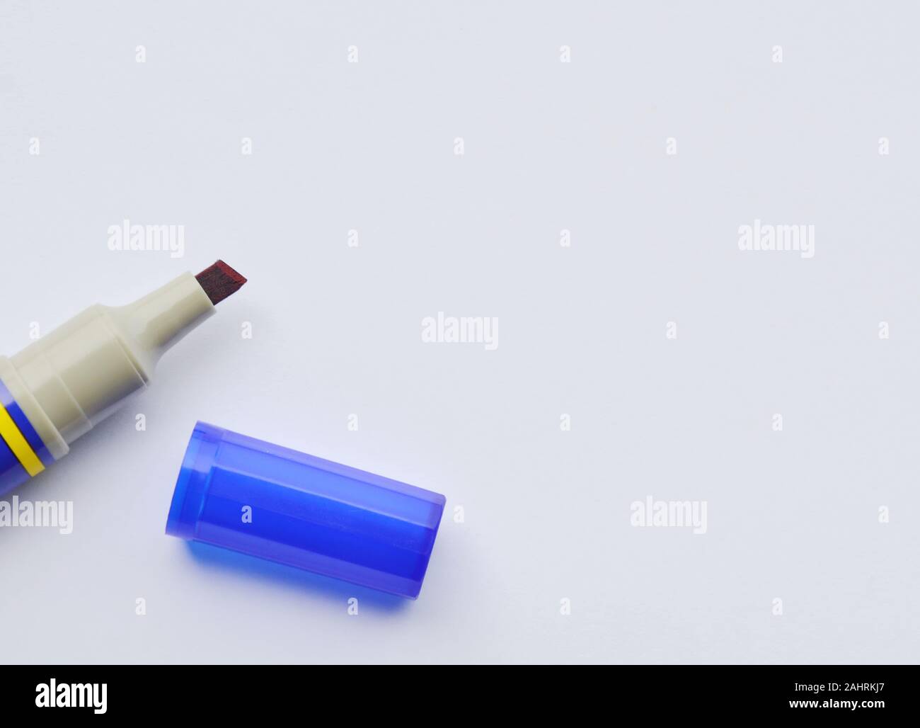 blue permanent marker pen and cover on white paper Stock Photo Alamy