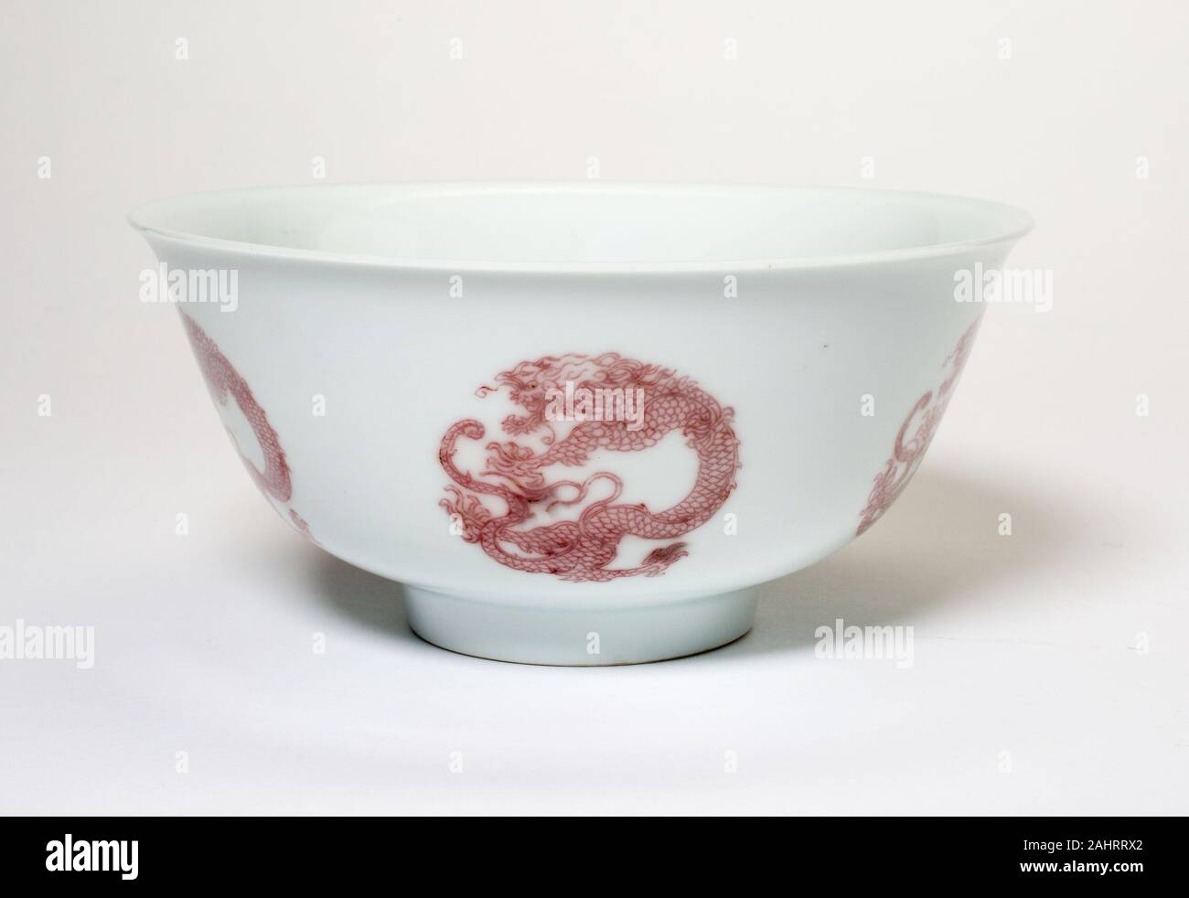 Bowl with Six Dragon Medallions. 1662–1722. China. Porcelain painted in underglaze copper red Stock Photo