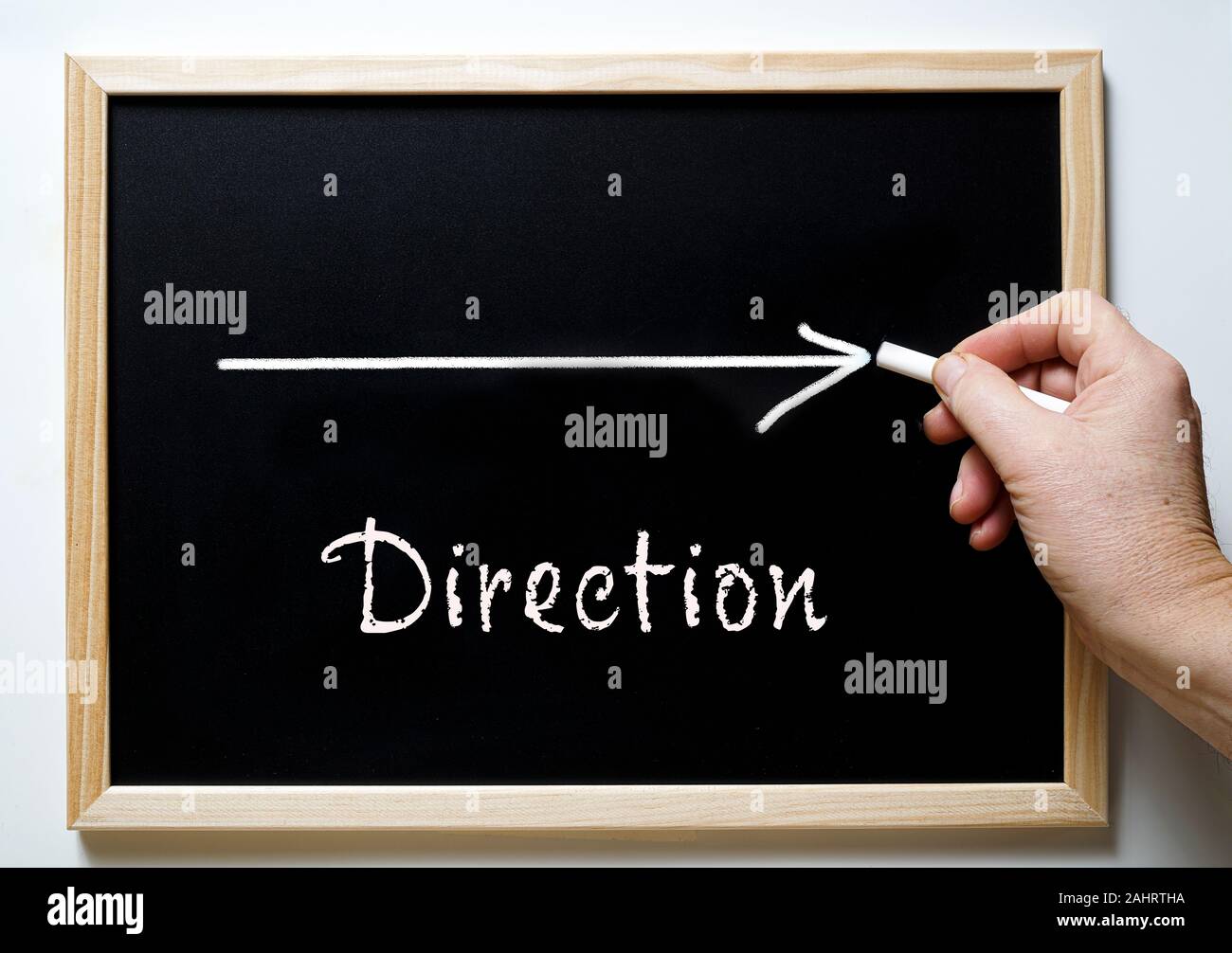 blackboard with writing direction and an arrow indicating the right Stock Photo