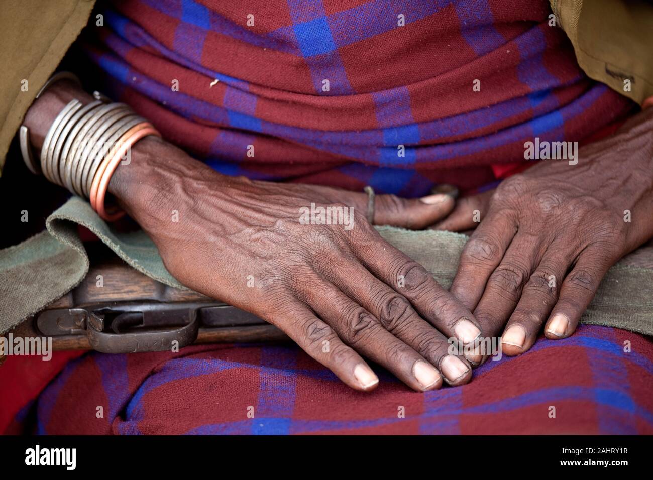 Hands of a Dassanech tribesman, warrior, holding a rifle, Omo valley, Ethiopia Stock Photo