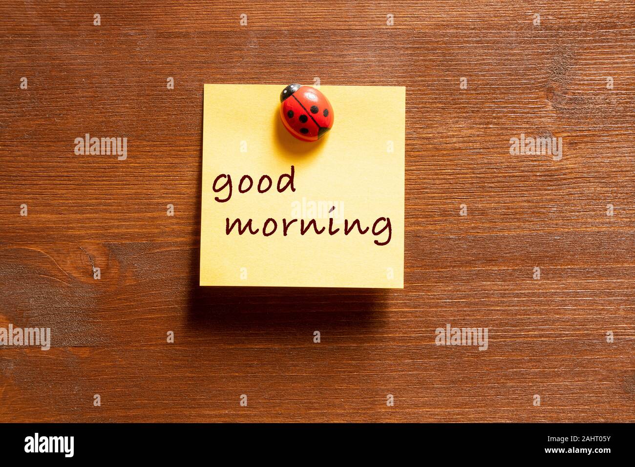 a colored memo sheet with writing  good morning Stock Photo