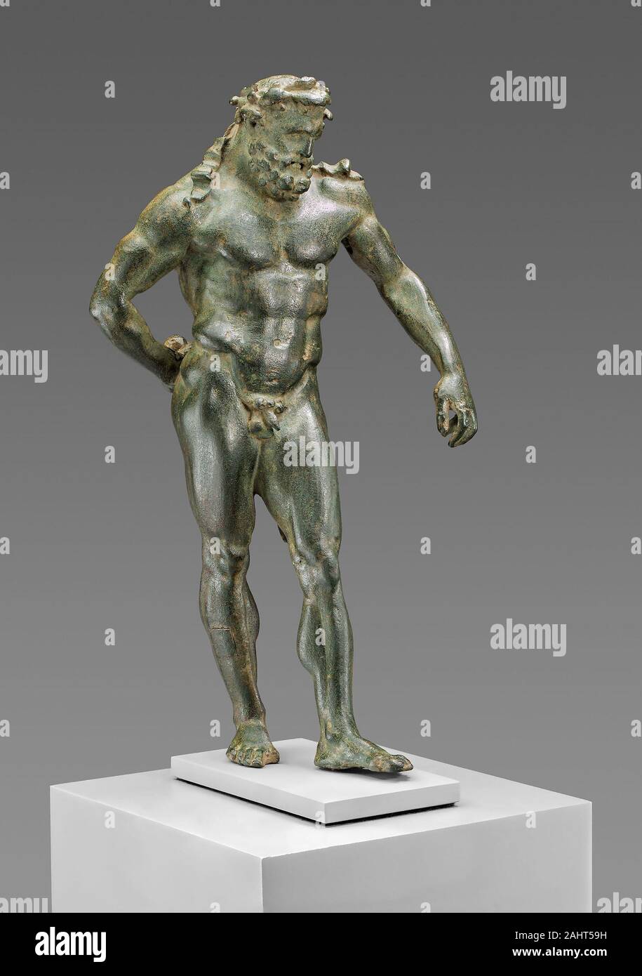 Ancient Roman. Statuette of Hercules. 50 AD–90 AD. Roman Empire. Bronze The weary hero Hercules stands at rest after completing his Eleventh Labor stealing three golden apples from a tree guarded by nymphs known as the Hesperides. Here, he holds the apples behind his back. Originally his left arm was supported by his club, which was cast separately and is now missing. This statuette is a copy of the lost masterpiece of Herakles by the Greek sculptor Lysippos, which became one of the definitive images of Hercules in classical antiquity and into the Renaissance in the 15th century. Stock Photo