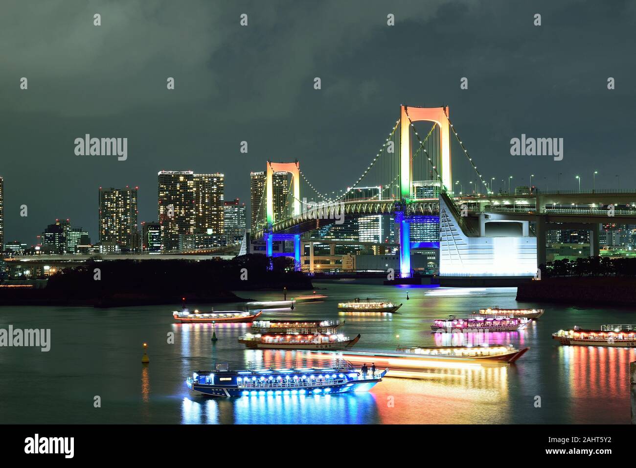 Urban Landscape Of Tokyo Rainbow Bridge With Illuminated Tourist Boats A Major Attraction In Tokyo Bay Area Stock Photo Alamy