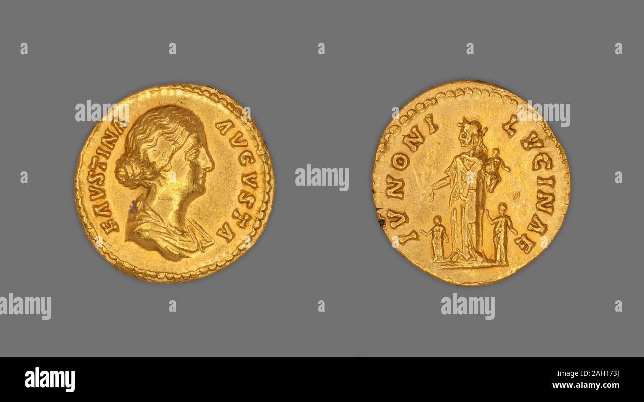 Ancient Roman. Aureus (Coin) Portraying Empress Faustina the Younger. 161 AD–175 AD. Rome. Gold Obverse Bust of Faustina the Younger right, bareheaded, drapedReverse Juno (or Faustina) standing left between two children; extends right over child, cradles infant in leftAntoninus Pius, living up to his name, portrays himself practicing religious rites by making a sacrifice to the gods. His daughter the empress Faustina the Younger, was paired with an image of Juno who, as the wife of Jupiter, symbolized marriage and family and acted as the divine protector of children. Rome encouraged large fami Stock Photo