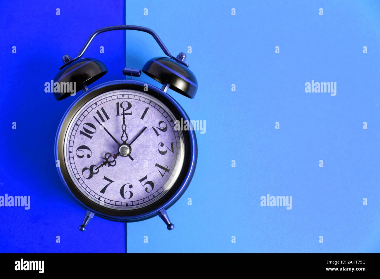 Old, vintage retro alarm clock on a bright blue background Stock Photo ...