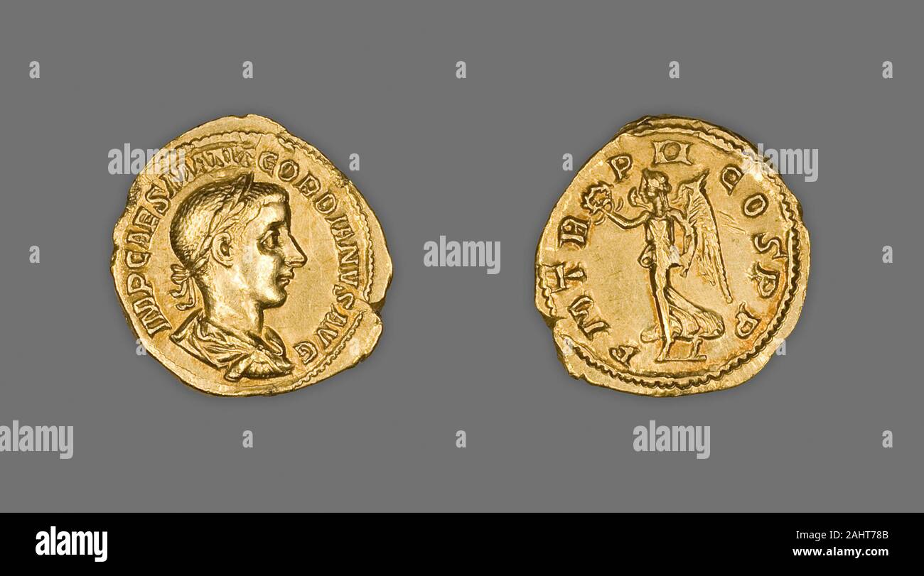 Ancient Roman. Aureus (Coin) Portraying Emperor Gordian III. 239 AD. Rome. Gold Obverse Bust of Gordian right, laureate, wearing cuirass and paludamentumReverse Victory walks left, wreath in right hand, palm branch over left shoulder Stock Photo