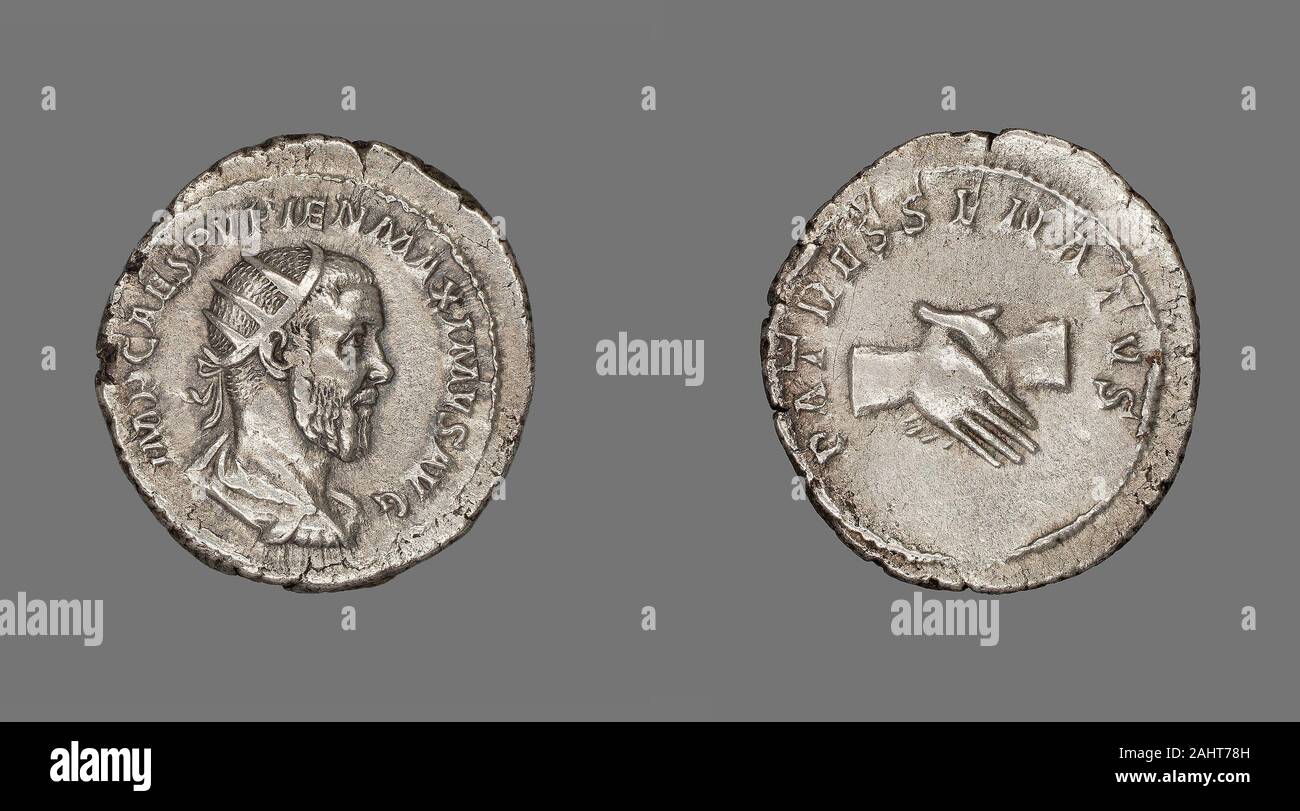 Ancient Roman. Antoninianus (Coin) Portraying Emperor Pupienus. 238 AD. Rome. Silver Obverse Bust of Pupienus right, radiate crown, wearing cuirass and paludamentumReverse Hands clasped Stock Photo