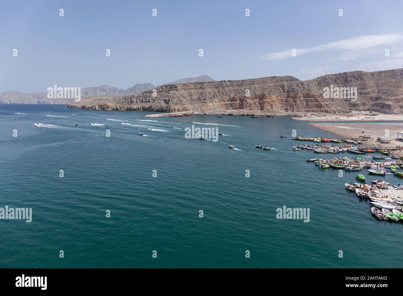 Iranian smugglers transporting illigal agricultural products and luxury goods from Oman to Iran with small boats from the harbor of Khasab, Oman Stock Photo
