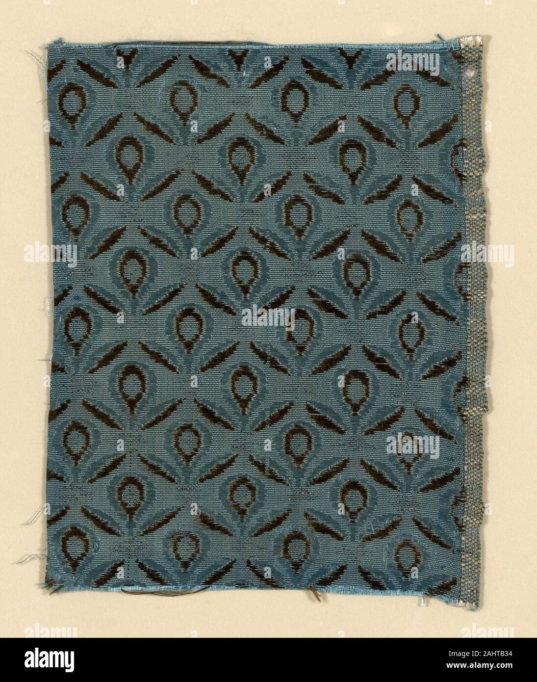 Fragment. 1775–1800. Spain. Silk and silvered-metal strip, warp-faced weft-ribbed plain weave with supplementary patterning wefts Stock Photo