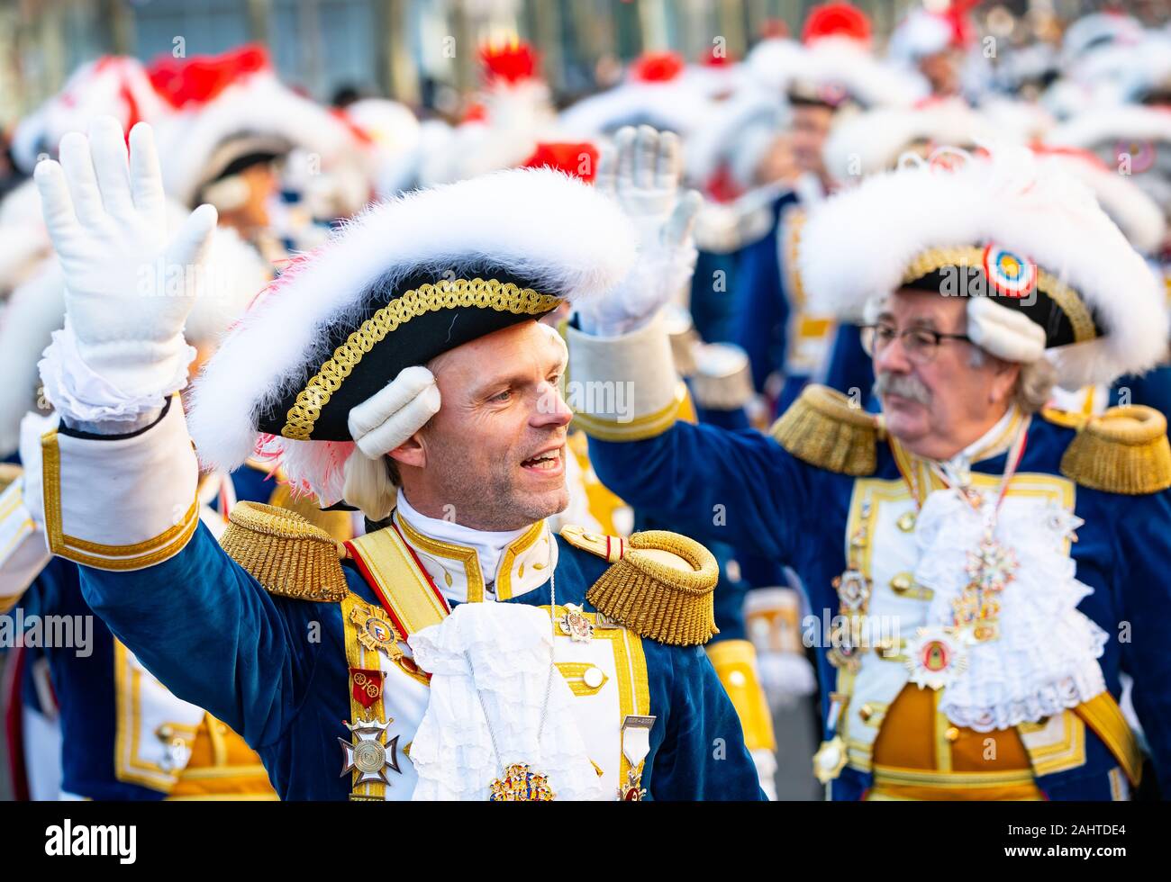 Mainz, Germany. 01st Jan, 2020. A guardsman greets the audience with 'Prosit New Year'. The traditional New Year's procession of the Mainzer Garden through the state capital is the foolish start to the 2020 carnival campaign. Credit: Andreas Arnold/dpa/Alamy Live News Stock Photo