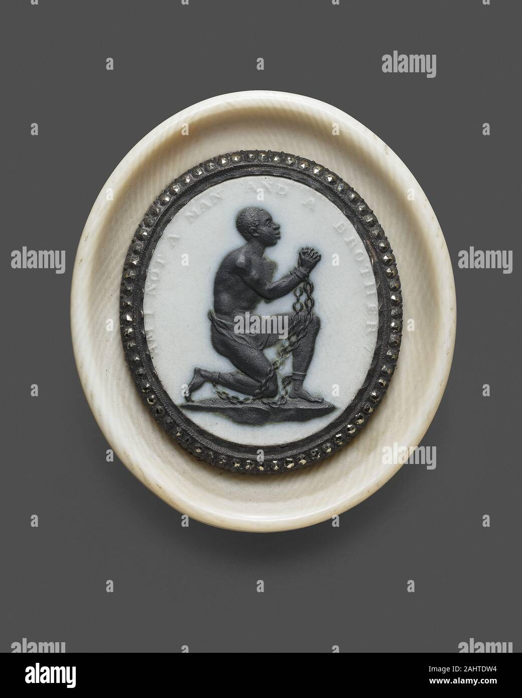 Wedgwood Manufactory (Manufacturer). Anti-Slavery Medallion. 1787. Burslem. Stoneware (jasperware and black basalt), cut steel, and ivory A man of African descent, kneeling and shackled in chains, poses the powerful question Am I not a Man and a Brother Employing a stark contrast of black against a white background, here the Wedgwood pottery used its famous jasperware technique to tackle an issue dear to its founders’ heart the abolition of the slave trade. Josiah Wedgwood was part of a prominent circle of antislavery reformers and entrepreneurs, along with activist Thomas Clarkson and the phy Stock Photo