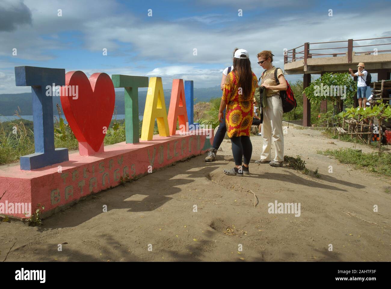 Tourists with the I Love Taal sign at the top of Taal Volcano, Talisay, Batangas Province, Philippines. Stock Photo