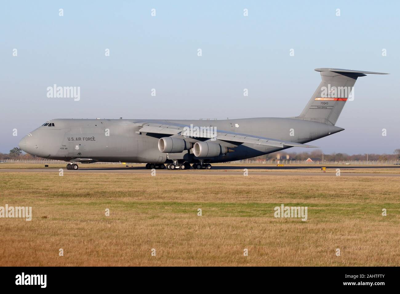 US Air Force Reserve C-5M Super Galaxy departing RAF Mildenhall on a bright morning. Stock Photo
