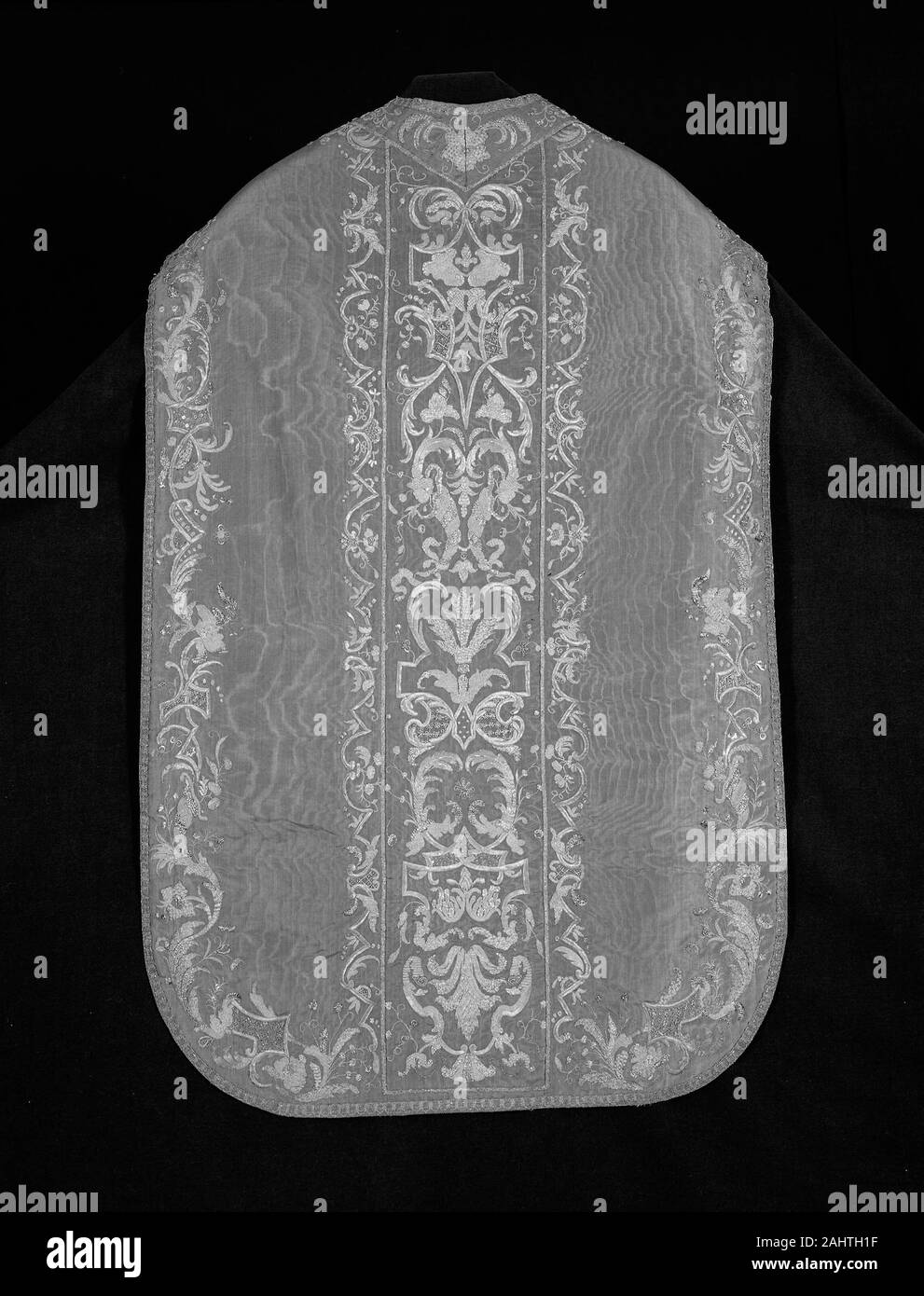 Chasuble, Stole, and Maniple. 1675–1725. France. Silk, warp-faced, weft-ribbed plain weave; watered (moiré); underlaid with linen, plain weave; embroidered with gilt-metal strips, spangles, pieces, and wire, and gilt-metal-strip-wrapped silk (file and frisé), in laid work, couching, padded couching, and French knots; edged with gilt-metal-strips and gilt-metal-strip-wrapped silk, bobbin-made tapes Stock Photo