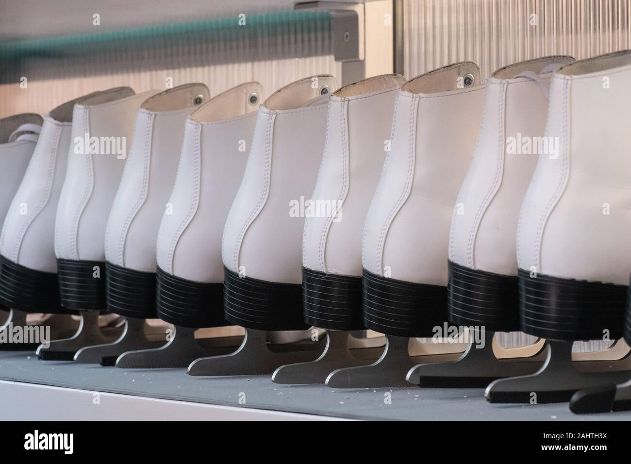 Ice skates on display at small popup ice rink in Covent Garden during