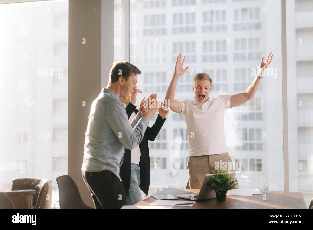 Happy young business team are celebrating the successful conclusion ...