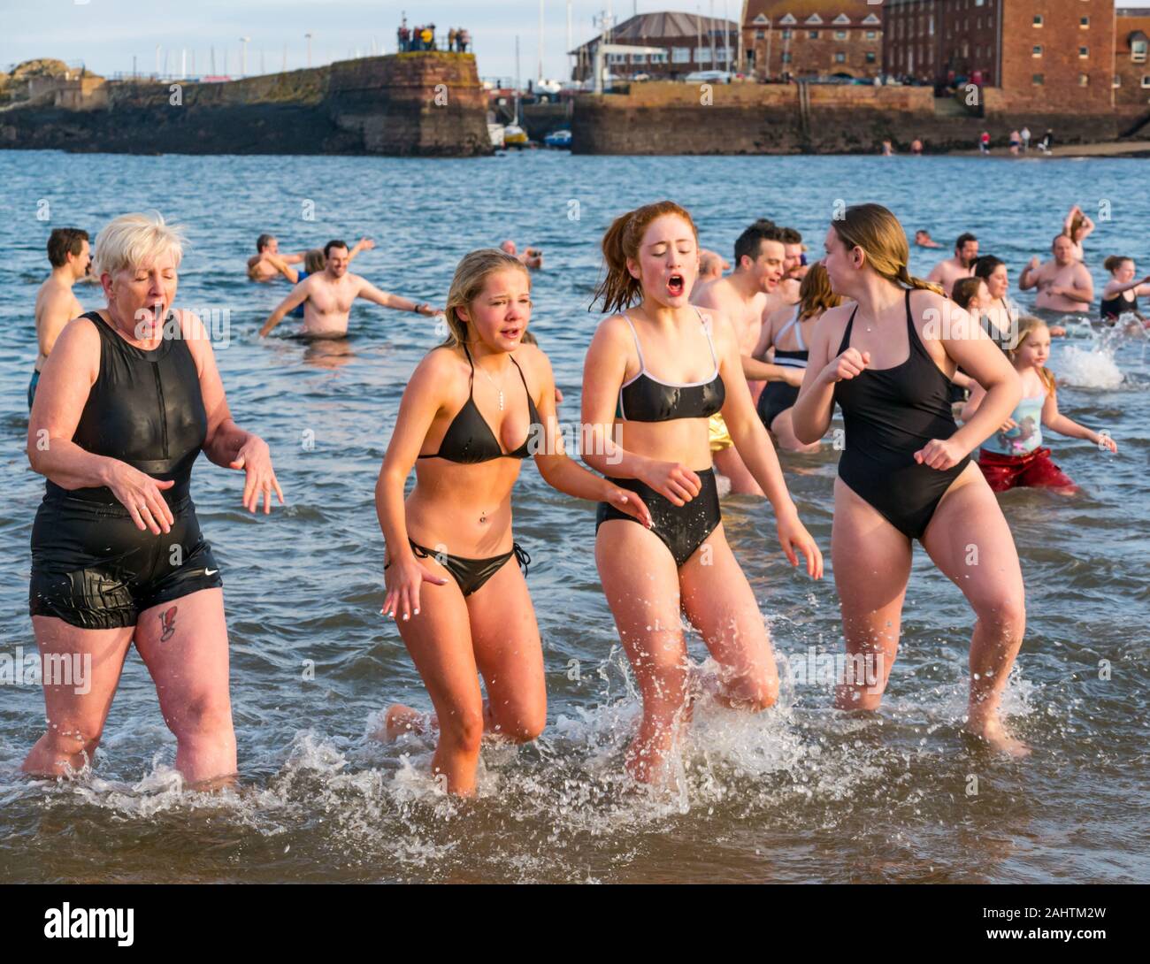 North Berwick, East Lothian, United Kingdom, 01 January 2020. Loony Dook:  Hundreds of people brave the chilly water of the Firth of Forth to welcome  2020 in a Scottish New Year tradition,