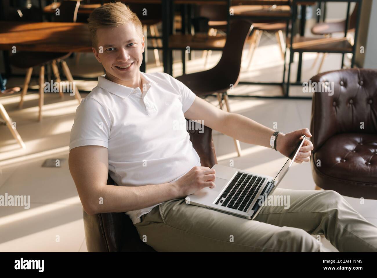 Handsome handsome young business man working with a laptop Stock Photo