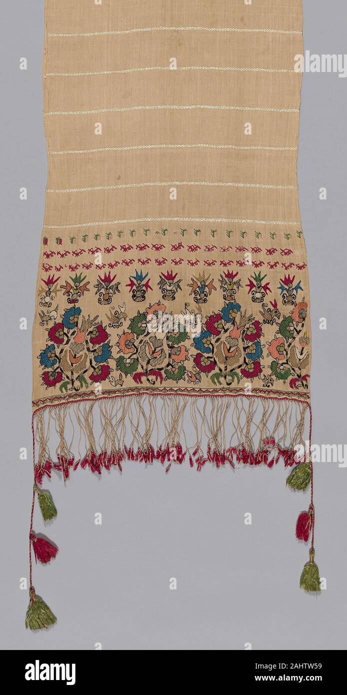 Towel. 1701–1800. Mytilene. Linen and silk, plain weave self patterned by ground weft floats; embroidered with silk and gilt-metal-strip-wrapped silk in Bosnian, flat, double running, running (pattern darning) twined double running, and satin stitches; edged with plied warp fringe with silk and gilt-metal-strip-wrapped silk tassels Stock Photo