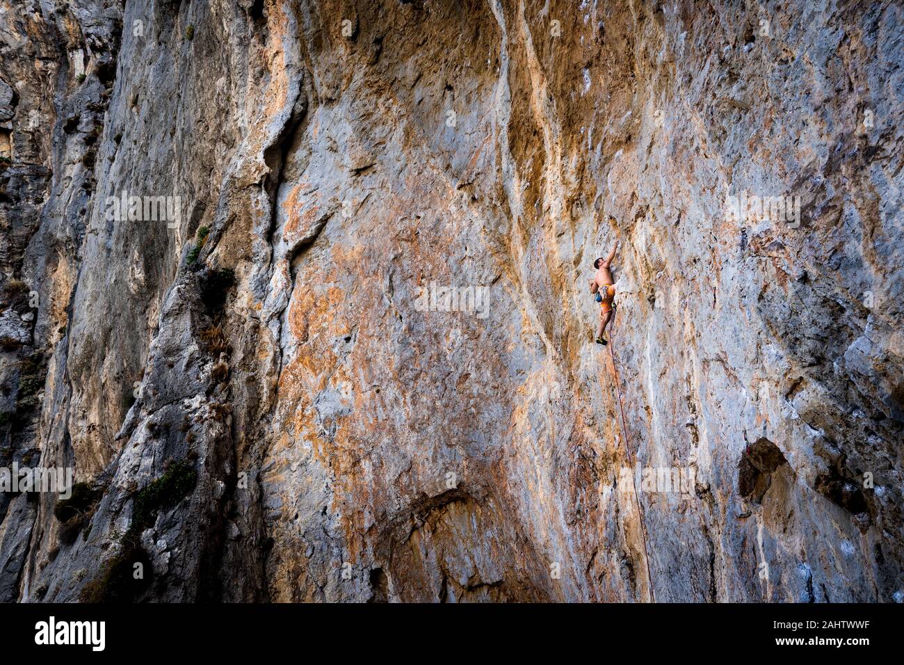 Man Rock Climbing on Rock Face in Kalydna on Kalymnos Island, Greece Stock Photo