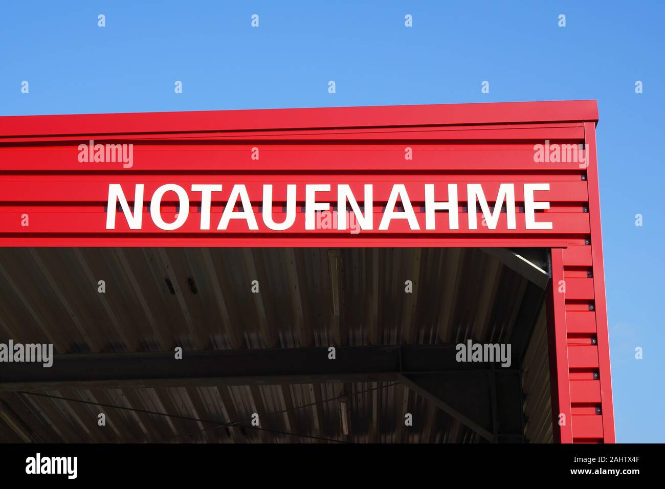 Notaufnahme translates as accident and emergency or casualty department in German - sign on hospital roof Stock Photo