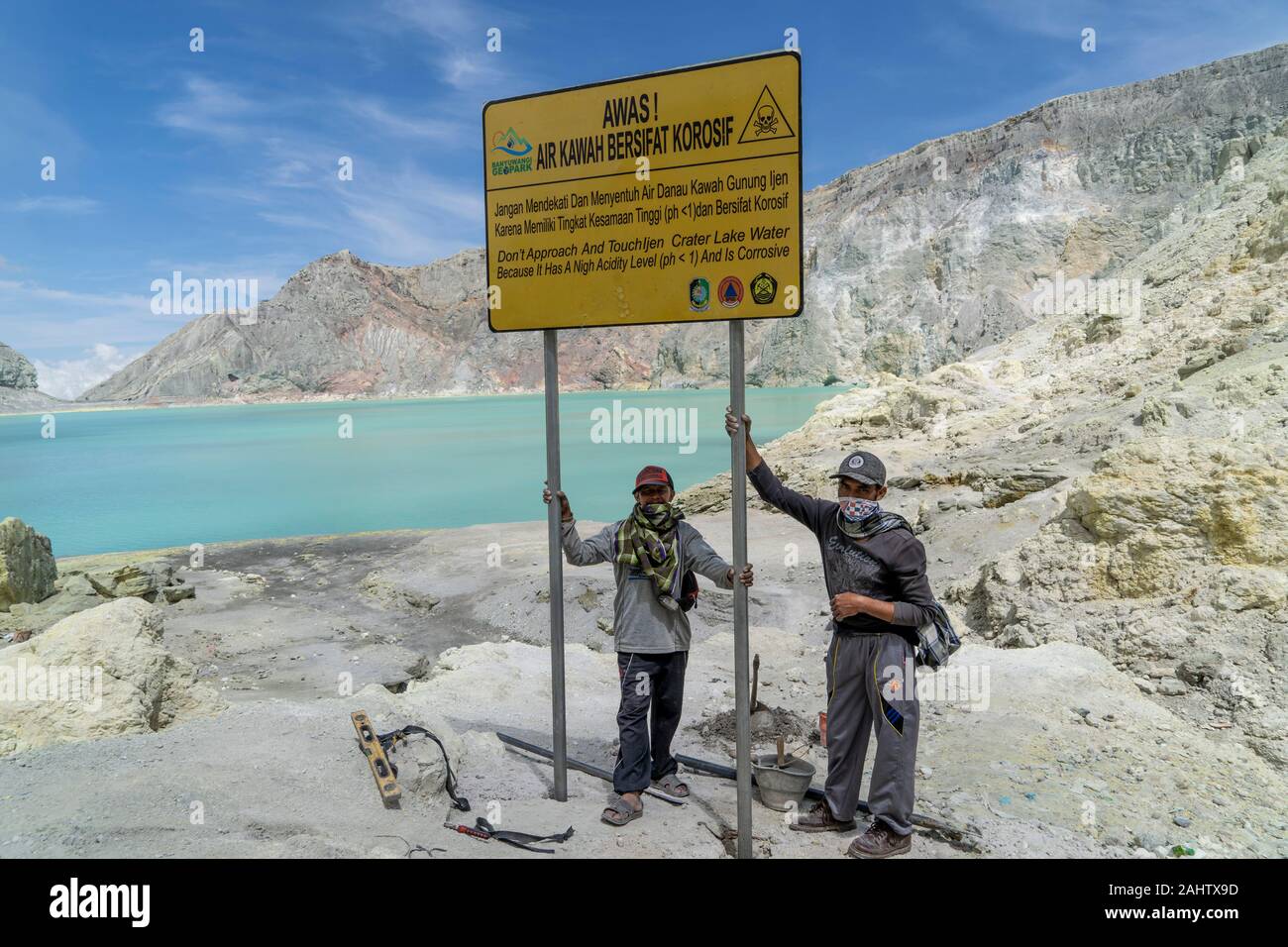 Indonesian miners put up a sign warming tourists to stay away from the ...