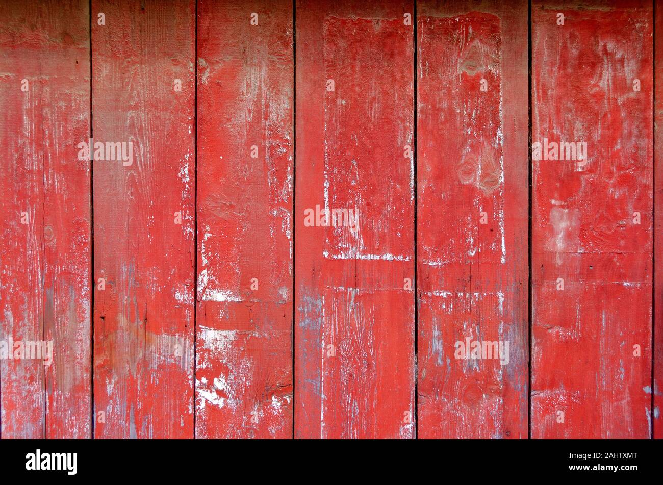 wooden wall made from upright old falu-red painted planks Stock Photo
