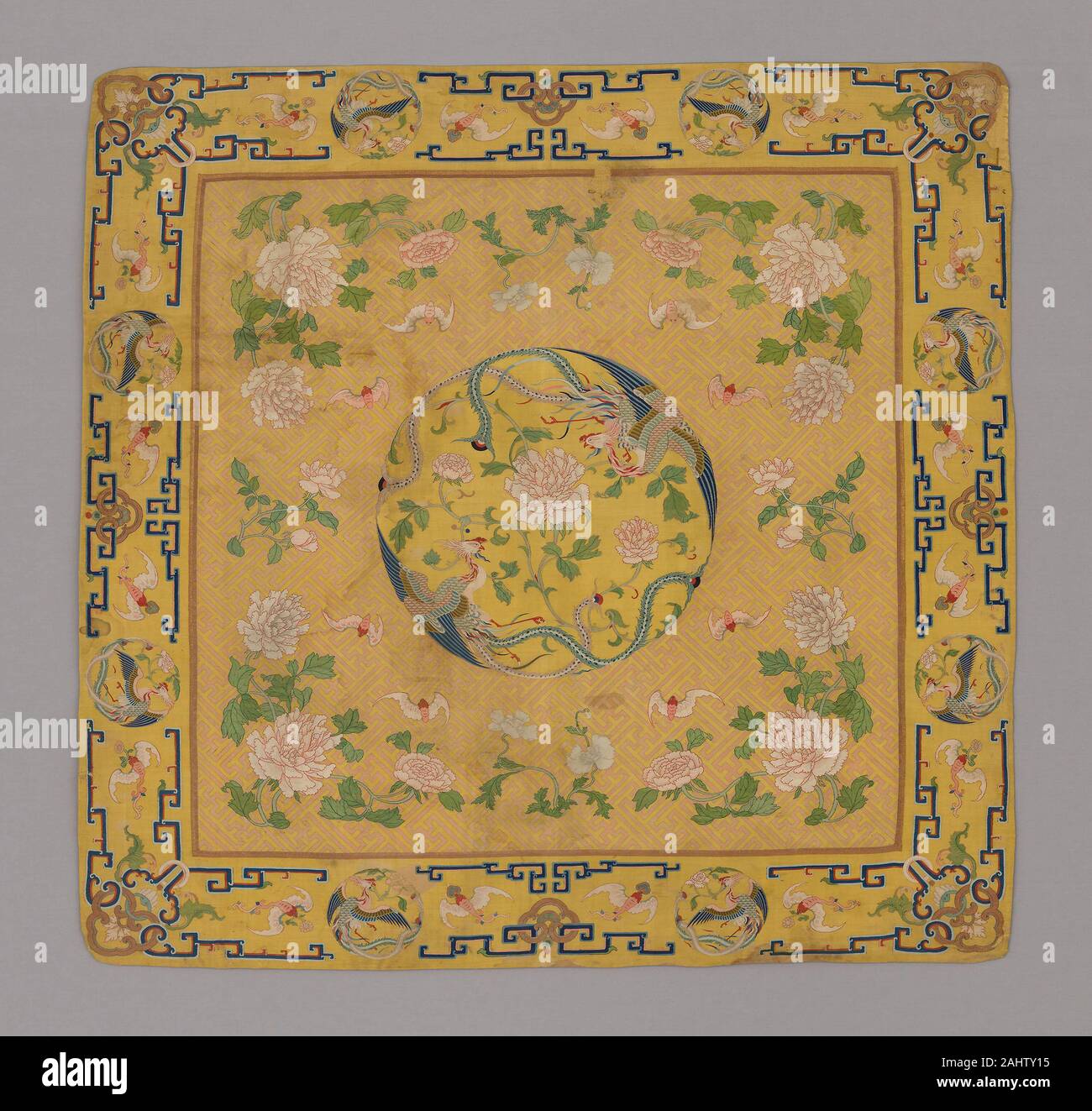 Manchu. Cushion Cover. 1700–1750. China. Silk and gold-leaf-over-lacquered-paper-strip-wrapped silk, slit and dovetailed tapestry weave with interlaced outlining wefts; painted details; lined with silk, warp-float faced 7 1 satin weave Stock Photo