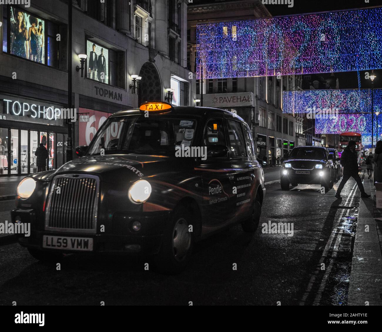 New Year on Oxford Street  with the iconic London black cab. Stock Photo