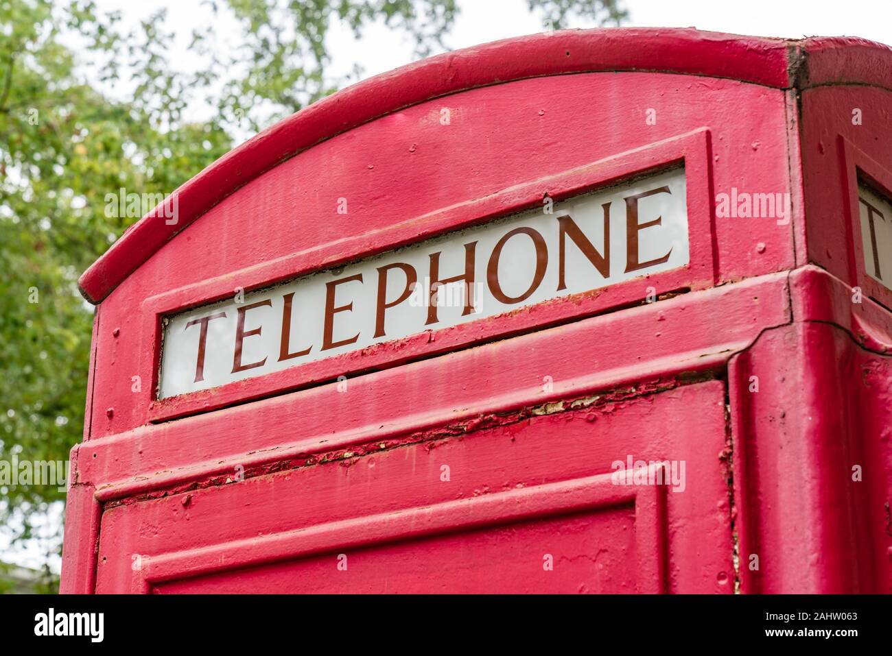 Old red British retro style telephone booth Stock Photo