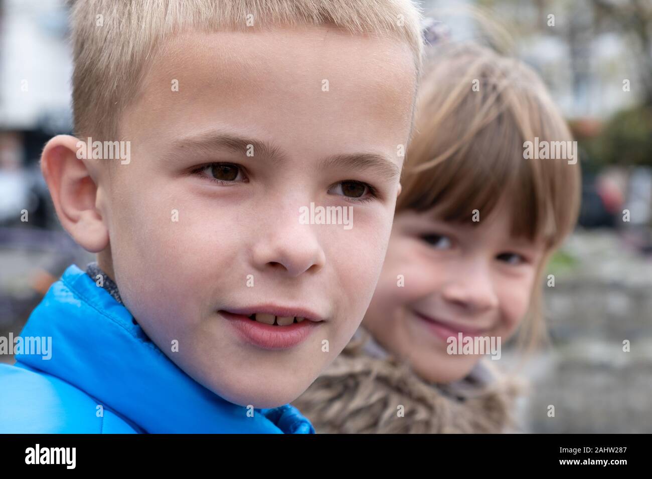 Closeup portrait of two children boy and girl tofether outdoors Stock ...