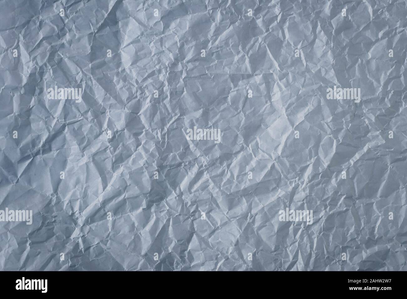 Crumpled gray paper background. Textured effect. Messy wrinkled parchment. Dark grey sheet texture Stock Photo