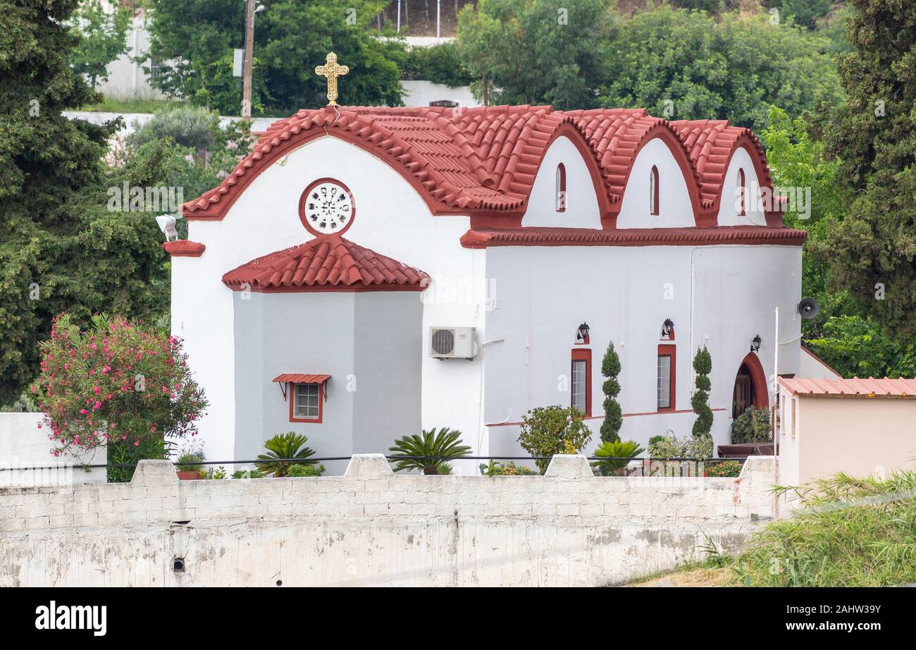 Church with red roof in Platania on Rhodes island, Greece Stock Photo