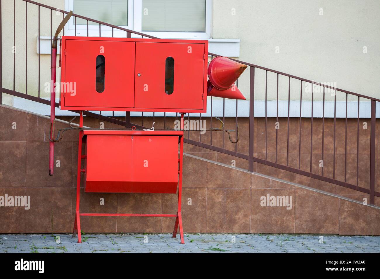 Red fire protection utencils outsine a building Stock Photo - Alamy