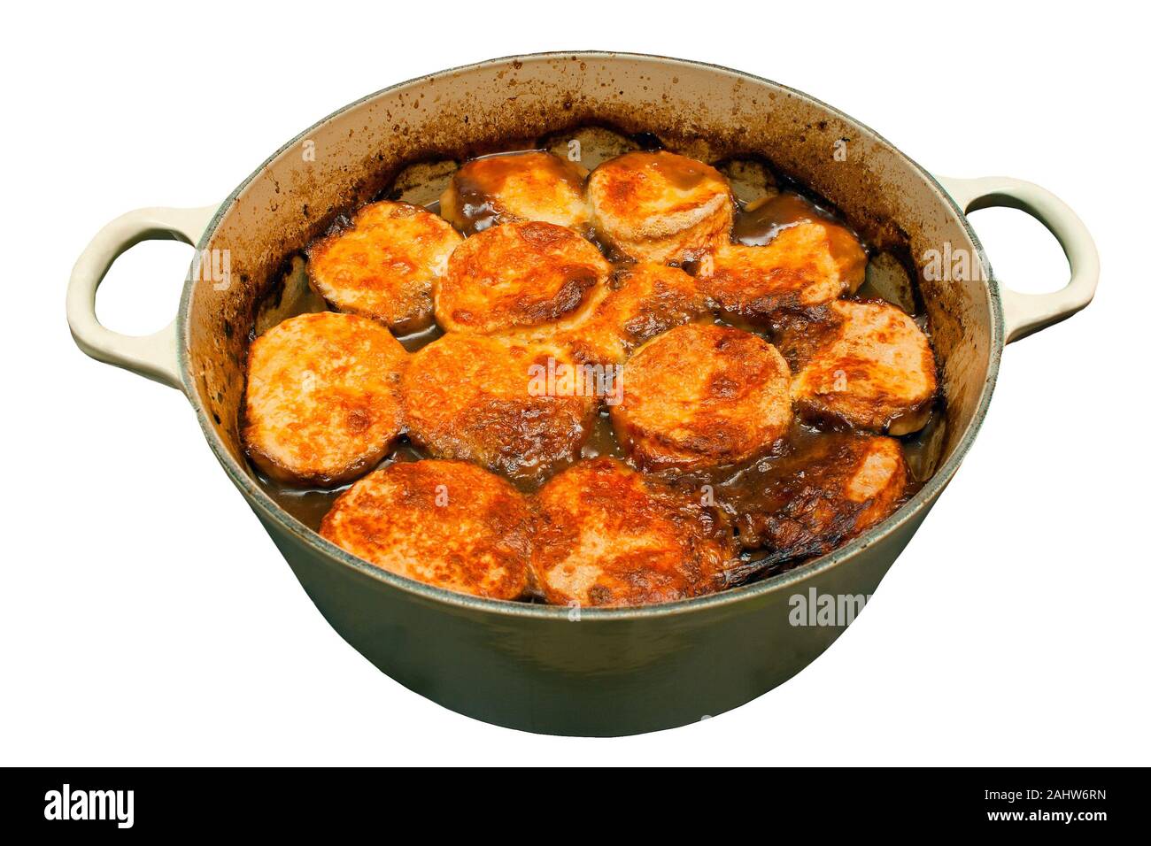 Beef stew and dumplings in a pan on an isolated white background Stock Photo