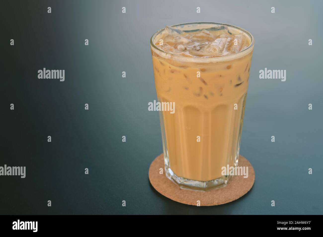 Cold coffee in glass on the dark table in cafe Stock Photo