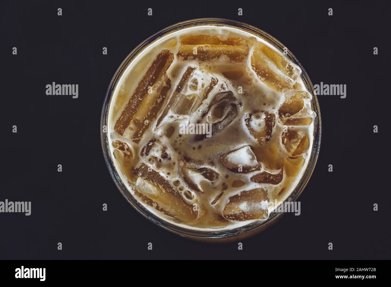 Cold coffee in glass on the dark table in cafe Top view Stock Photo