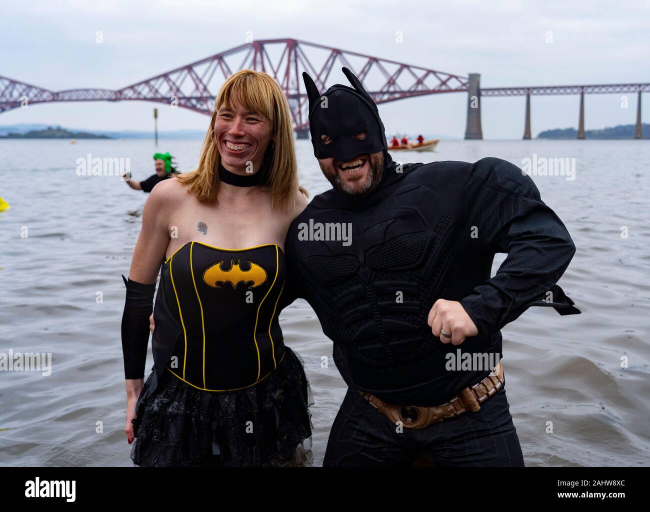 South Queensferry, Scotland, UK. 1st Jan 2020. People in fancy dress take the plunge into the Firth of Forth river during the annual New Year’s Day Loony Dook at South Queensferry. Iain Masterton/Alamy Live News Stock Photo
