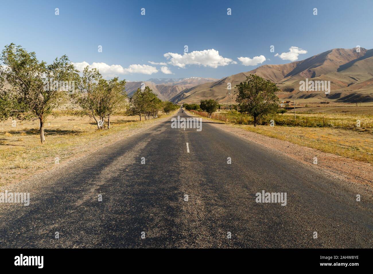 asphalt road, entrance to the Boom Gorge, Kyrgyzstan. Stock Photo