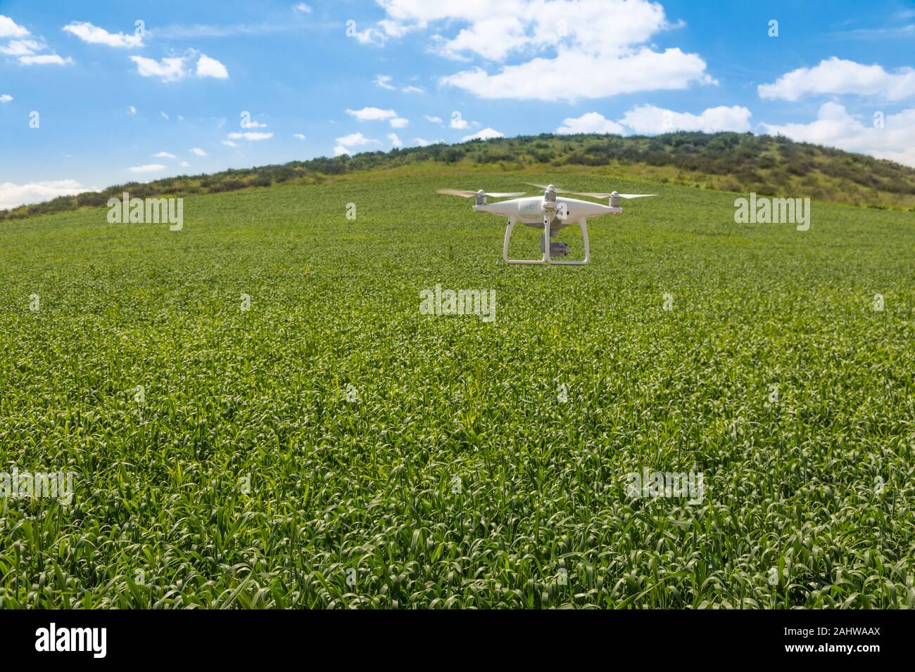 Drone Unmanned Aircraft Flying and Gathering Data Over Country Farmland. Stock Photo
