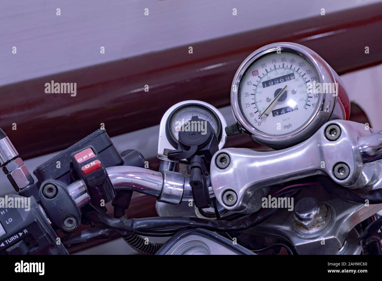 Motorcycle steering wheel, speedometer and switches. Close up. Top side view. Stock Photo