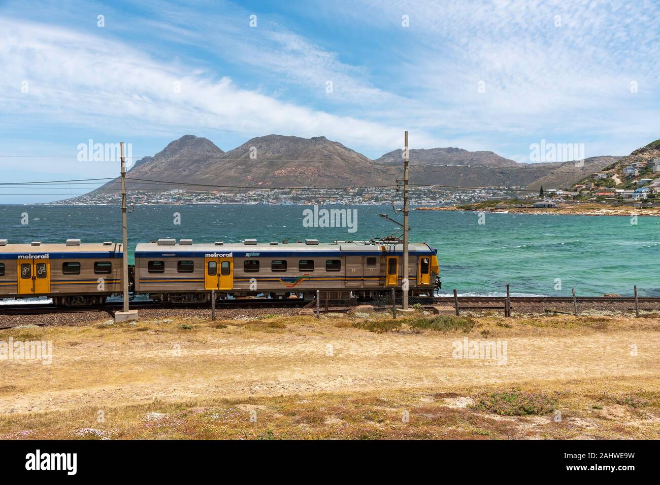 Glencairn, Cape Town, South Africa. Coastal passenger train passing the