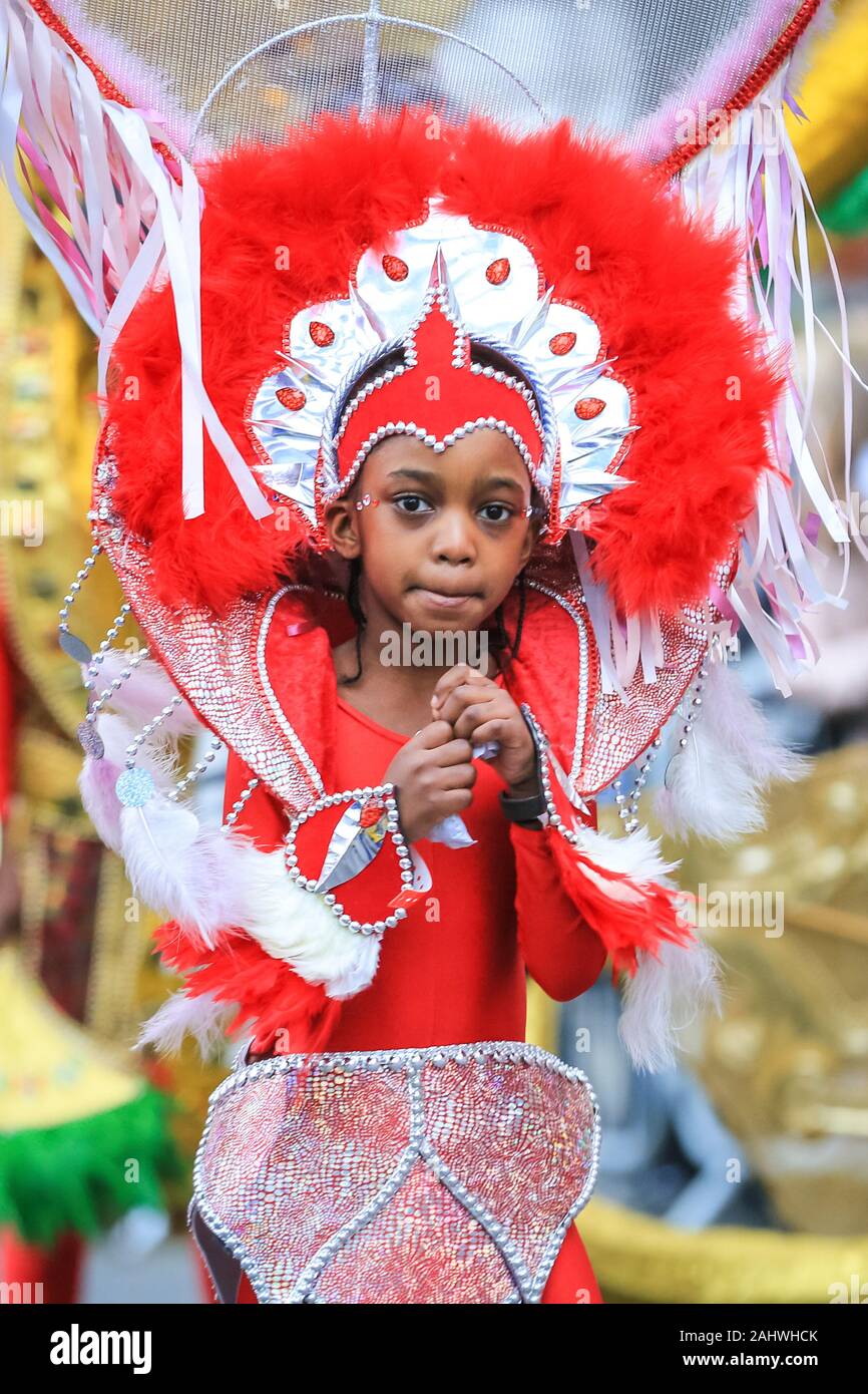 Central London, 1st Jan 2020. A young performer in carnival outfit, performing with the London Borough of Hackney. London rings in 2020 with the annual 'London’s New Year’s Day Parade', more fondly known by Londoners as LNYDP, and its spectacular performances along a route through central London. Credit: Imageplotter/Alamy Live News Stock Photo