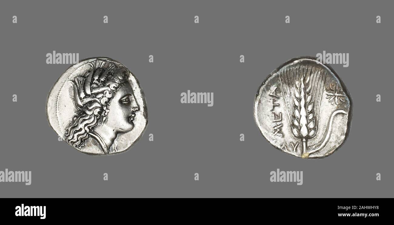 Ancient Greek. Stater (Coin) Depicting the Goddess Kore. 330 BC–300 BC. Metapontum. Silver Obverse Head of Kore crowned with grainReverse Ear of barley Stock Photo